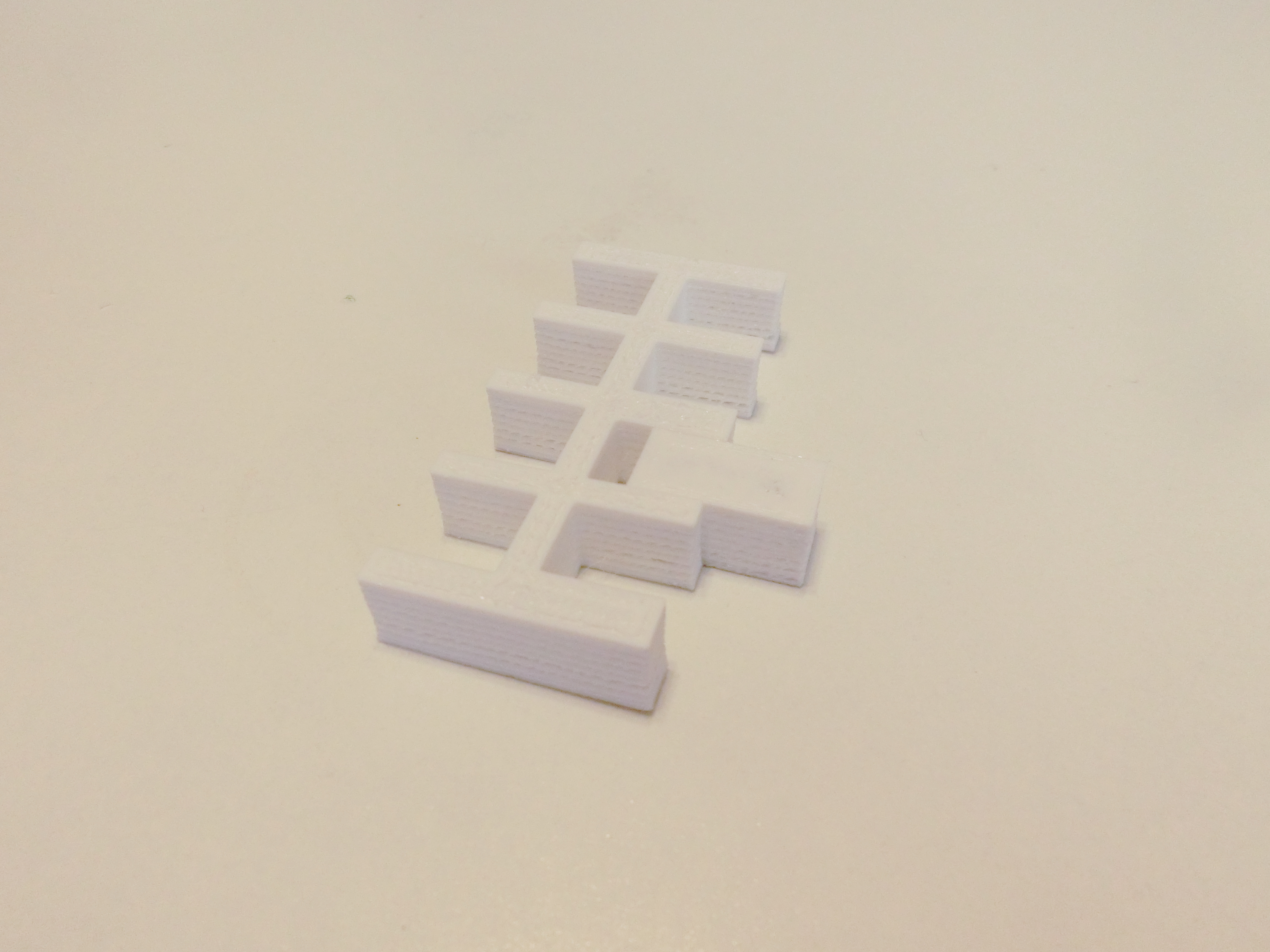 3D print of a form with several notches and another form to test the notches